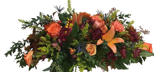 Bouquet of autumn flowers with orange, red, and green colors on a white background