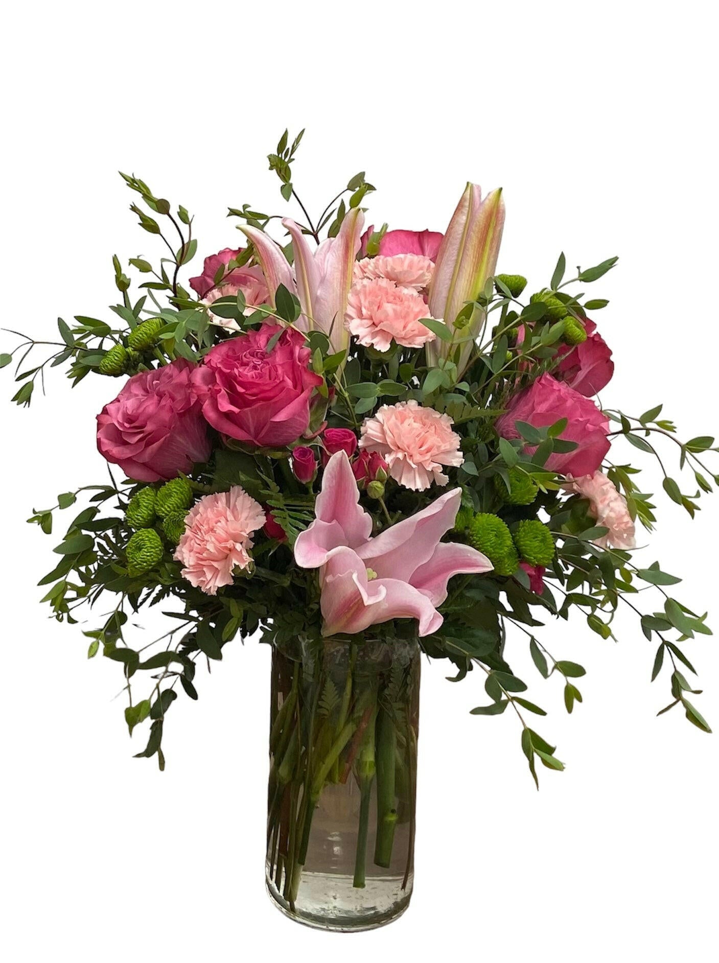 Bouquet of pink and purple flowers in a clear vase on a white background