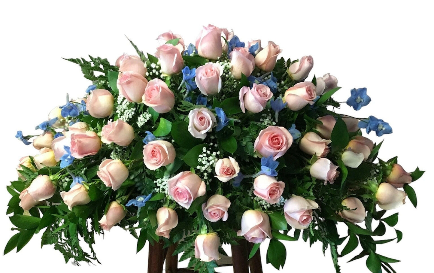 Cascade bouquet of pink and blue flowers with greenery on a white background