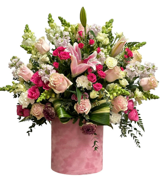 Bouquet of flowers in a pink Velvet vase