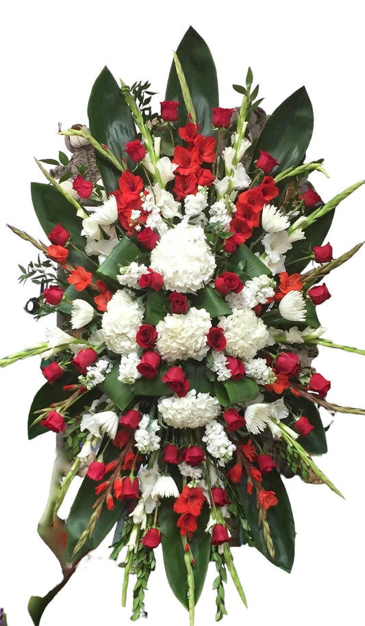 Floral arrangement with red and white flowers on a white background