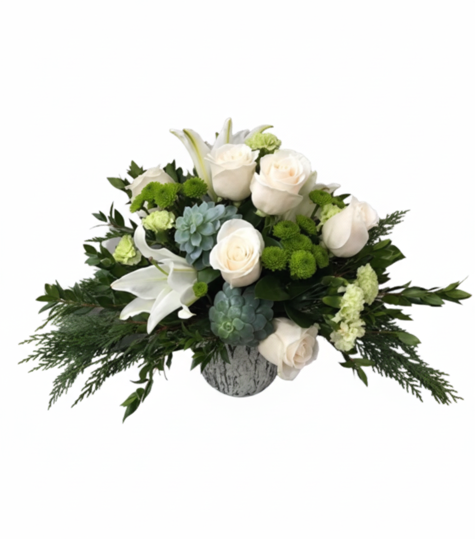  elegant, low-profile floral arrangement named "Snowflake Arrangement" in a textured white vase, set against a solid white background. It features pristine white roses and white oriental lilies, accented with clusters of vibrant green button chrysanthemums, blue-green succulents, and various deep green foliages including feathery cedar.