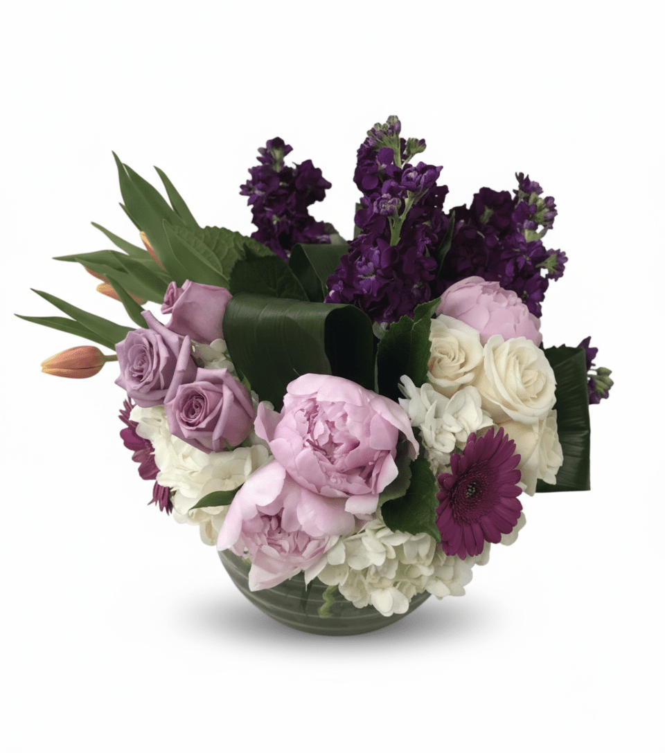 Bouquet of purple, pink, and white flowers with green leaves on a white background