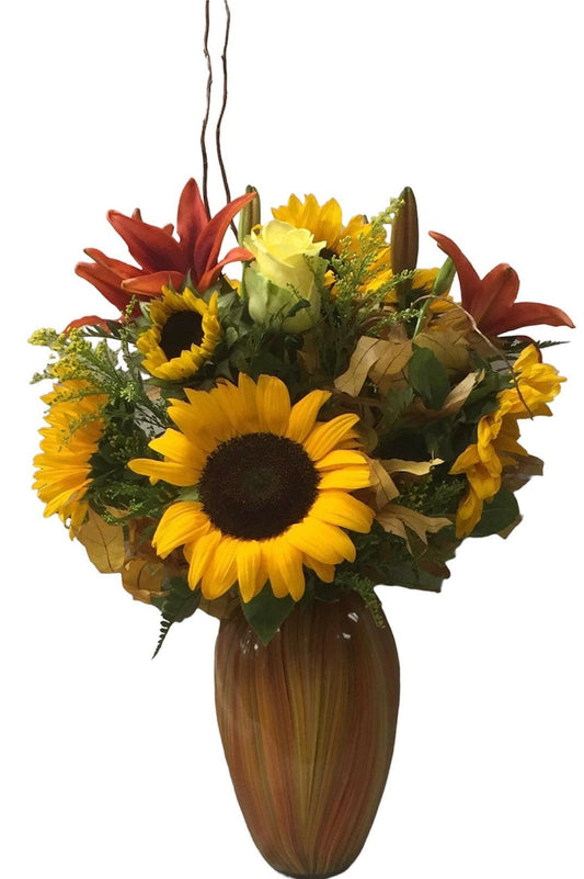 Bouquet of sunflowers and other flowers in a vase on a white background