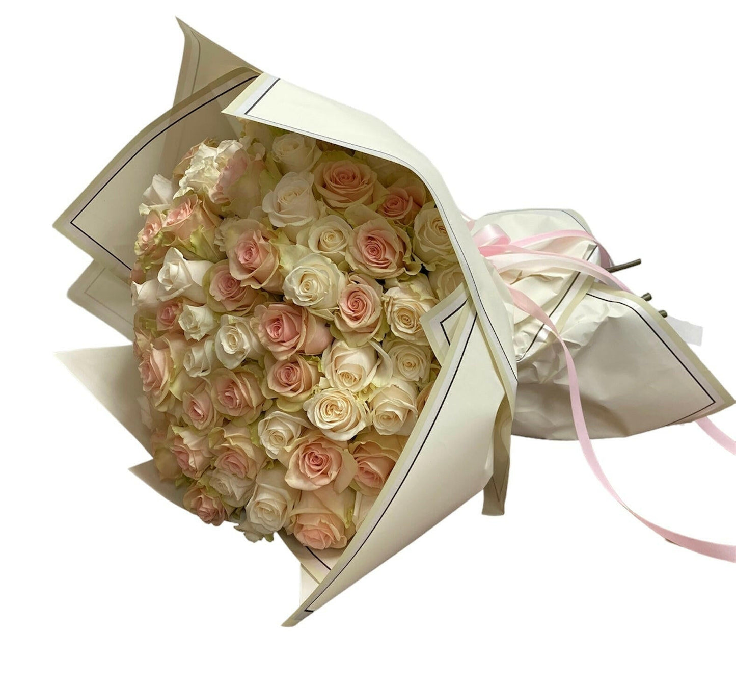 Bouquet of pink and white roses in a box with a pink ribbon on a white background