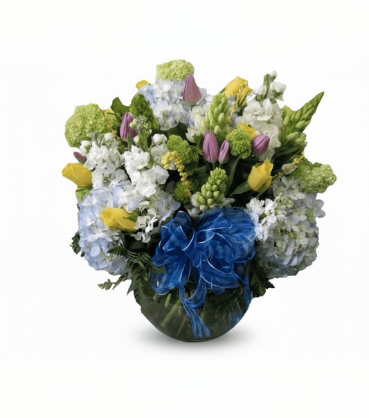 Colorful flower arrangement with a blue bow on a white background