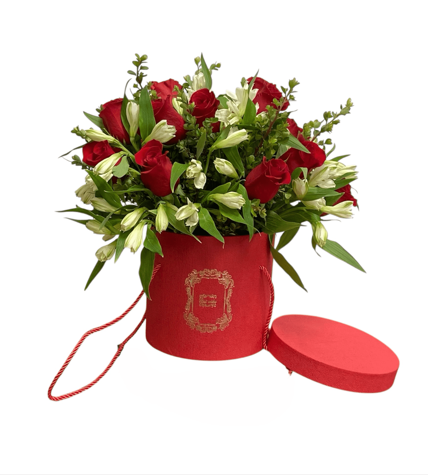Bouquet of red and white flowers in a red box with a heart-shaped lid on a white background