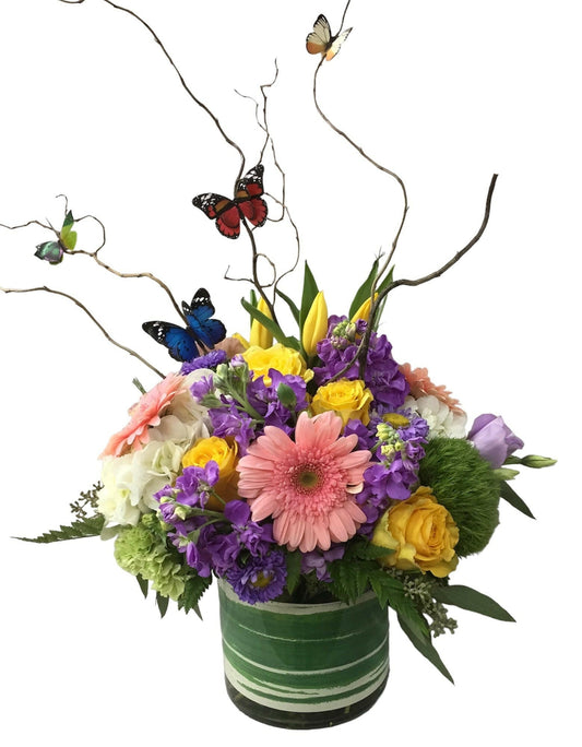 Colorful flower arrangement with butterflies on a white background