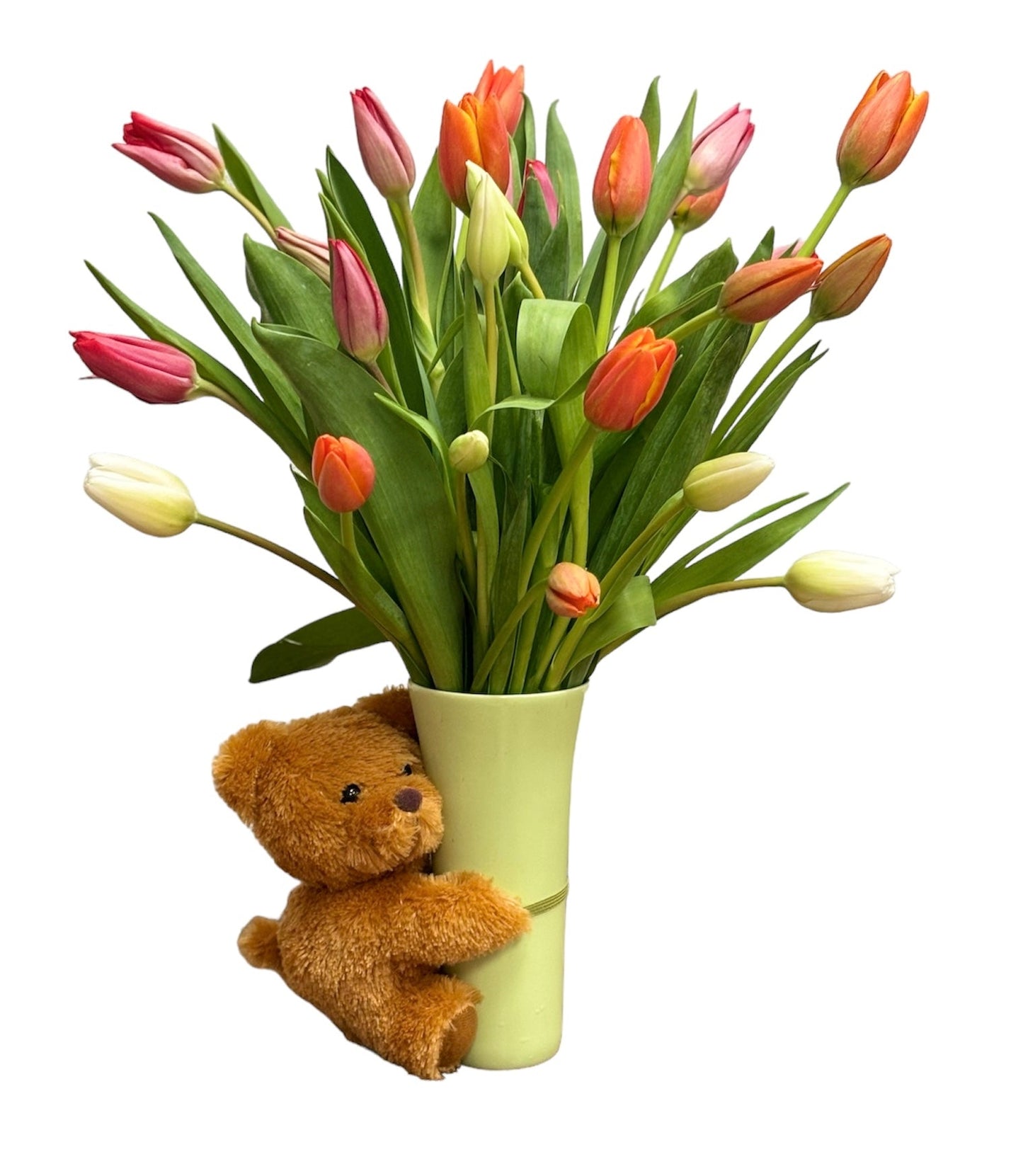 Bouquet of tulips with a teddy bear holding a green vase on a white background