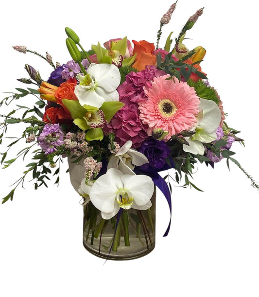 Colorful flower bouquet with a glass vase on a white background