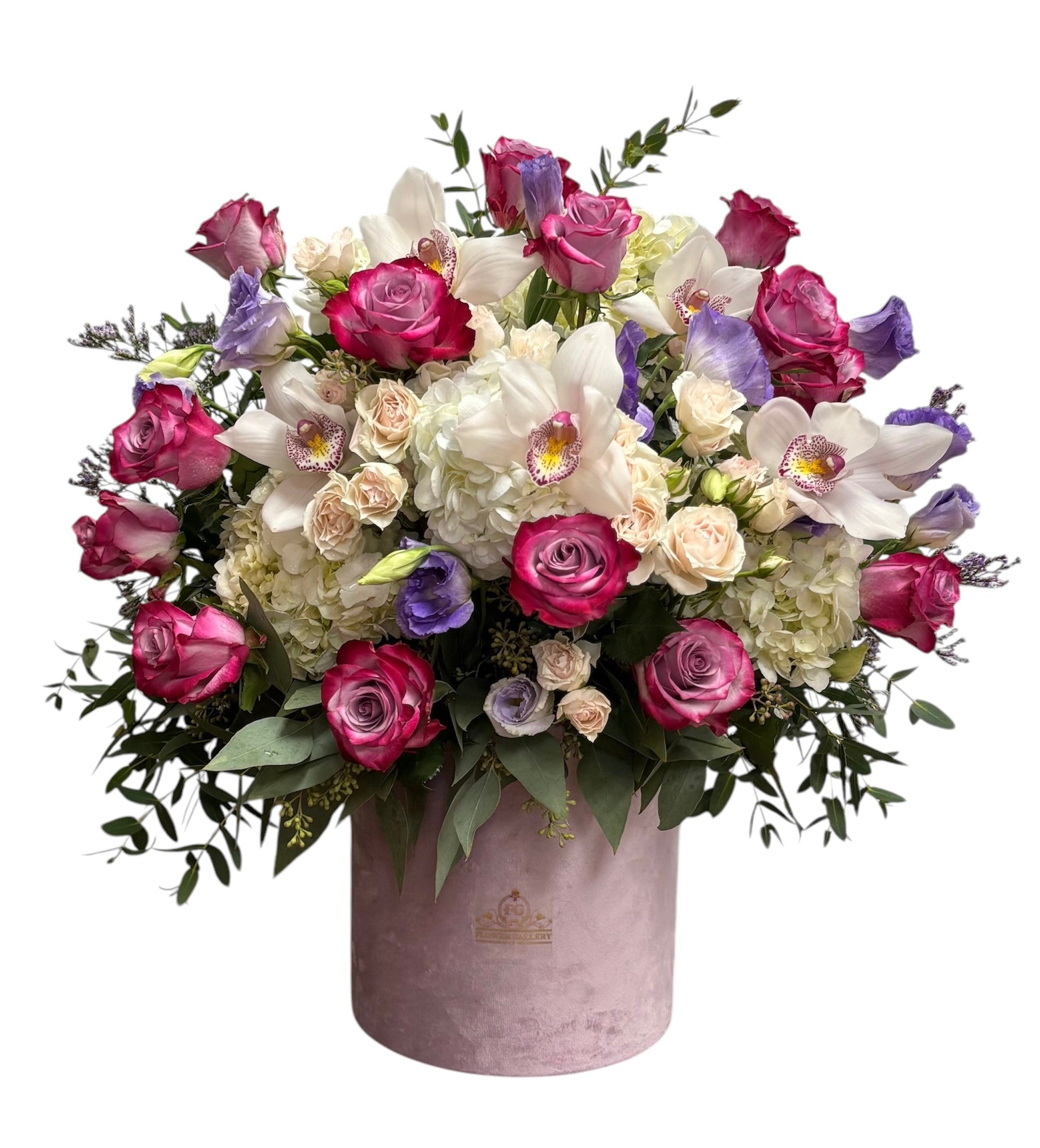Bouquet of flowers in a pink valvet container on a white background